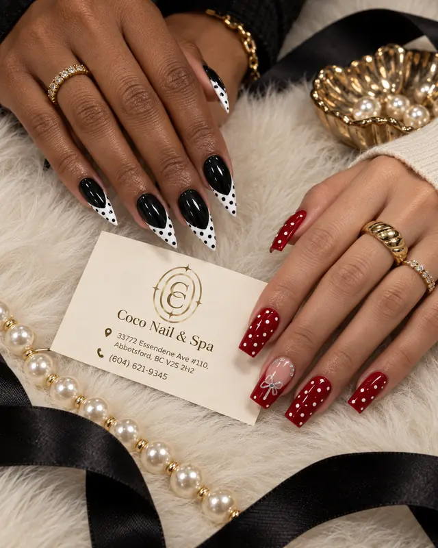 Red and black statement nails with graphic art